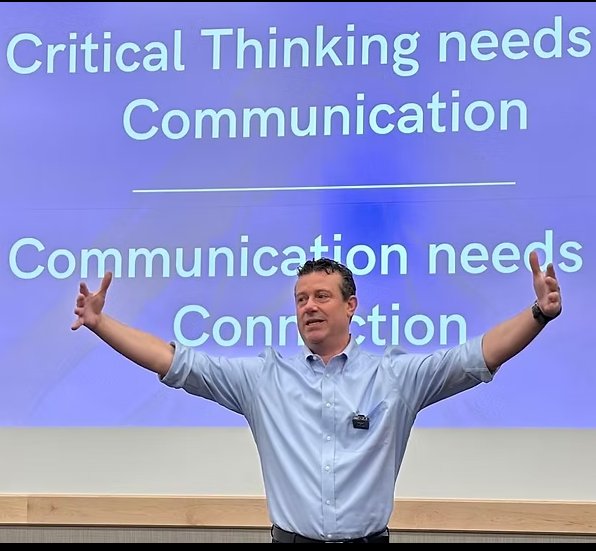 C. Lonnie McCann delivering a keynote on communication and connection